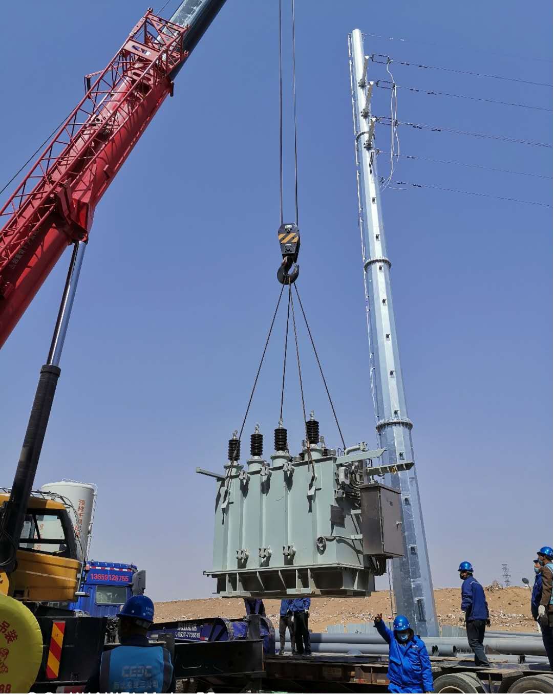 國源公司榆林生活垃圾發(fā)電項(xiàng)目主變壓器成功就位 (1).jpg